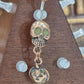 Painful Pleasures Skull & Pumpkin Glow Navel Ring in 14G Surgical Steel