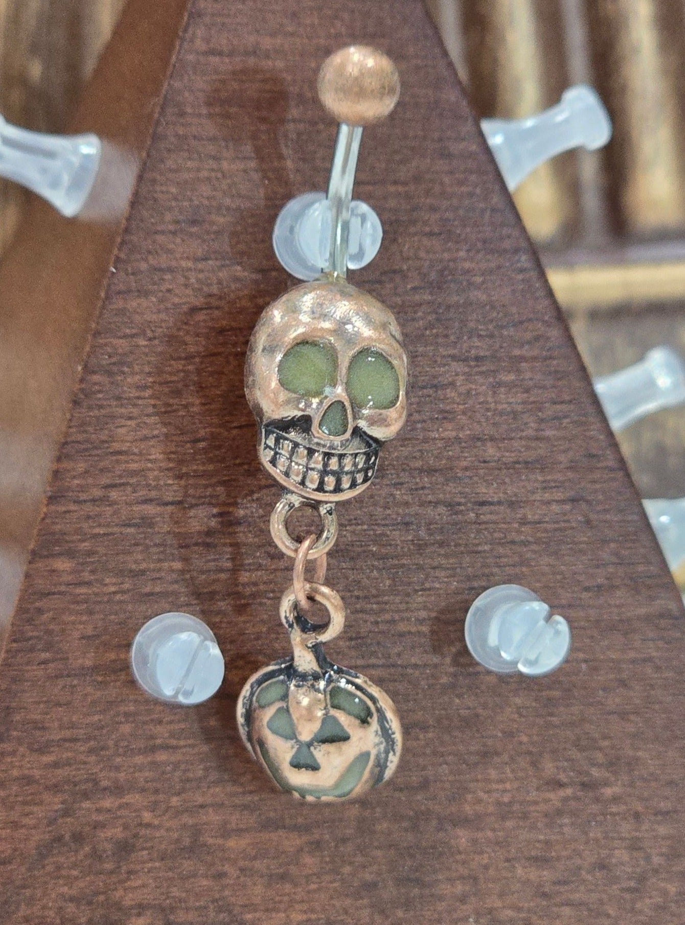 Painful Pleasures Skull & Pumpkin Glow Navel Ring in 14G Surgical Steel