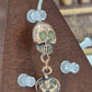 Painful Pleasures Skull & Pumpkin Glow Navel Ring in 14G Surgical Steel