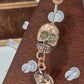 Painful Pleasures Skull & Pumpkin Glow Navel Ring in 14G Surgical Steel