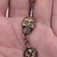 Painful Pleasures Skull & Pumpkin Glow Navel Ring in 14G Surgical Steel