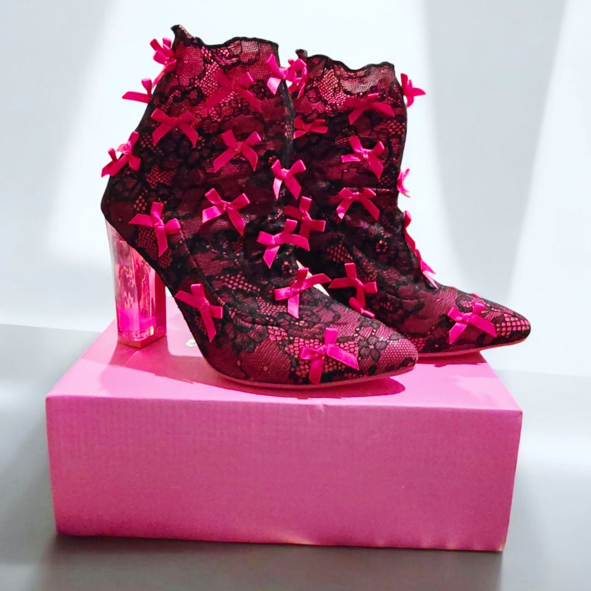 Rubina Portrait Mode Booties W/ Transparent Heel & Bow Accents -  - Shoes