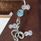 Painful Pleasures Blue Gem Snake Charm Navel Ring in 14G Surgical Steel