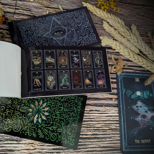 Collection of tarot cards with intricate designs on a wooden surface